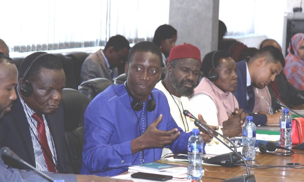 L R Hon. Felix Okot Ogong  Hon. Alhagie Mbowa and other MPs attending the committee meeting on migration scaled
