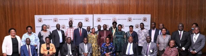 BoU Rallies MPs to Support the Proposed Amendments in the Bank of Uganda Act of 2000 MPs and BOU Staff Pose A Photo e1639236930560